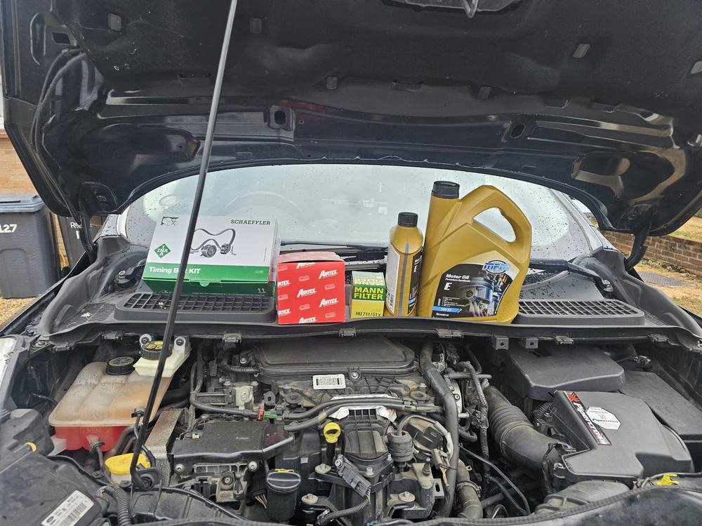 Filters and engine oil ready on an engine bay