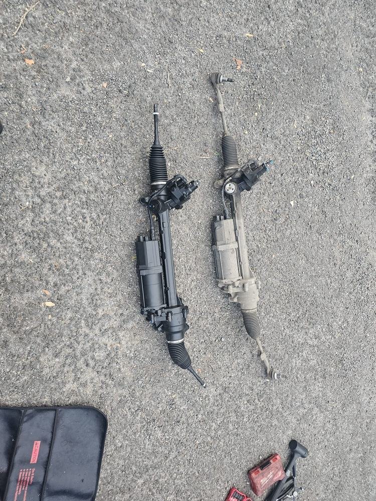 Two steering components laid out on the ground